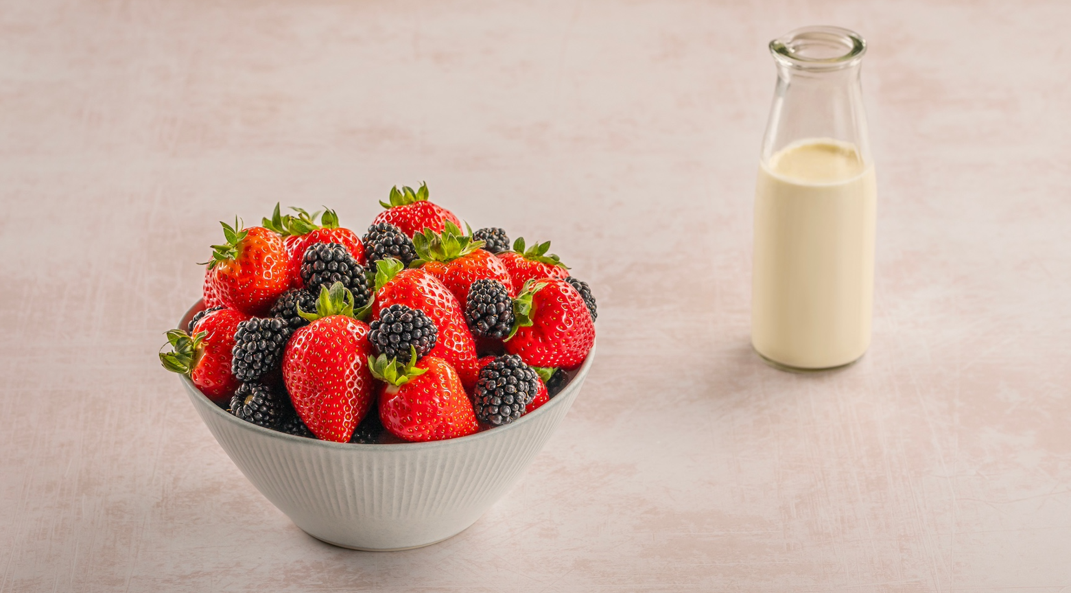 bowl of fruit with cream