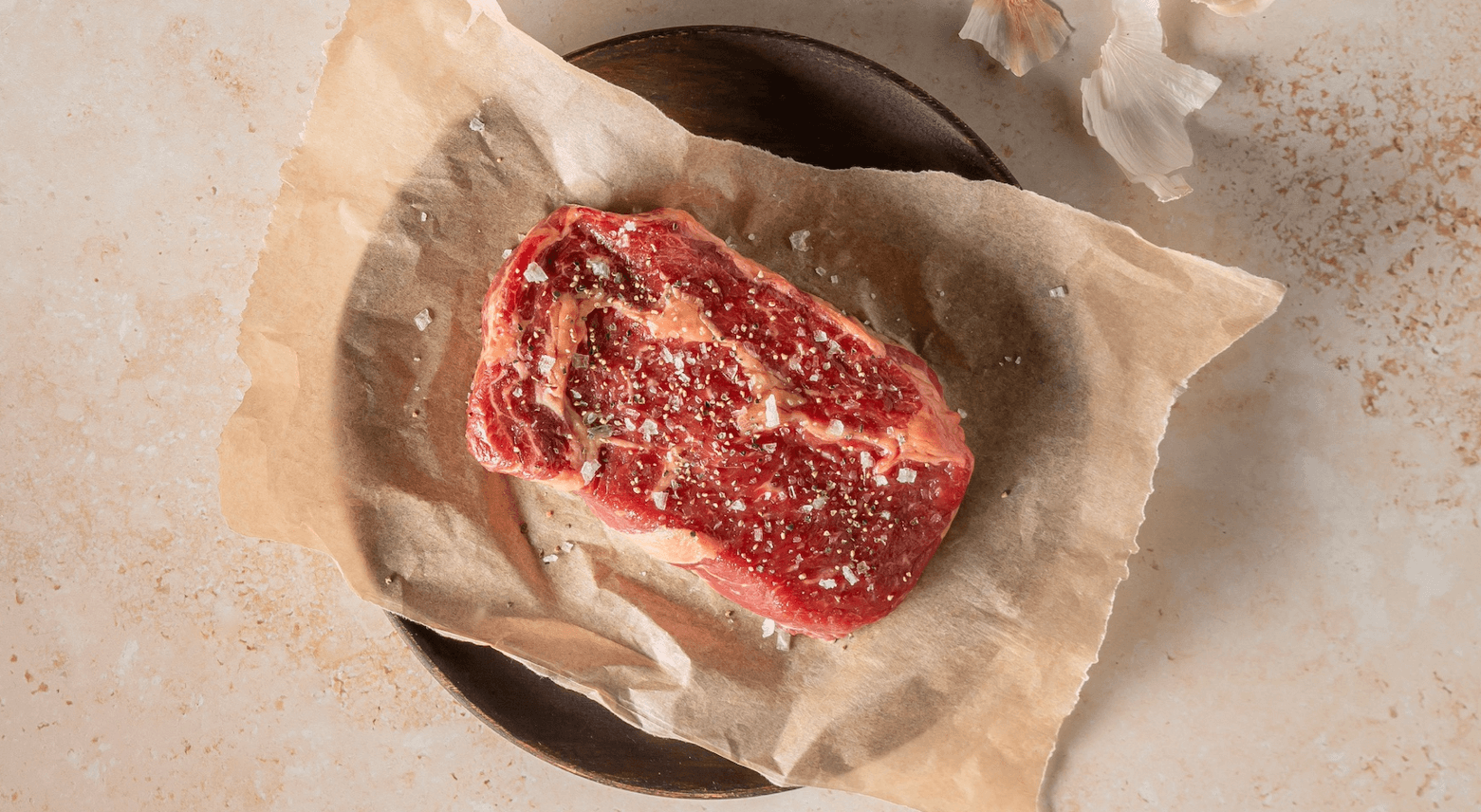 raw beef on brown paper