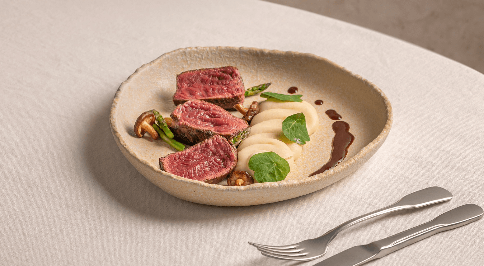 venison on a plate with mashed potato